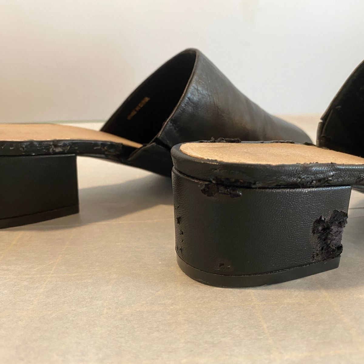 Black shoes with damaged heels